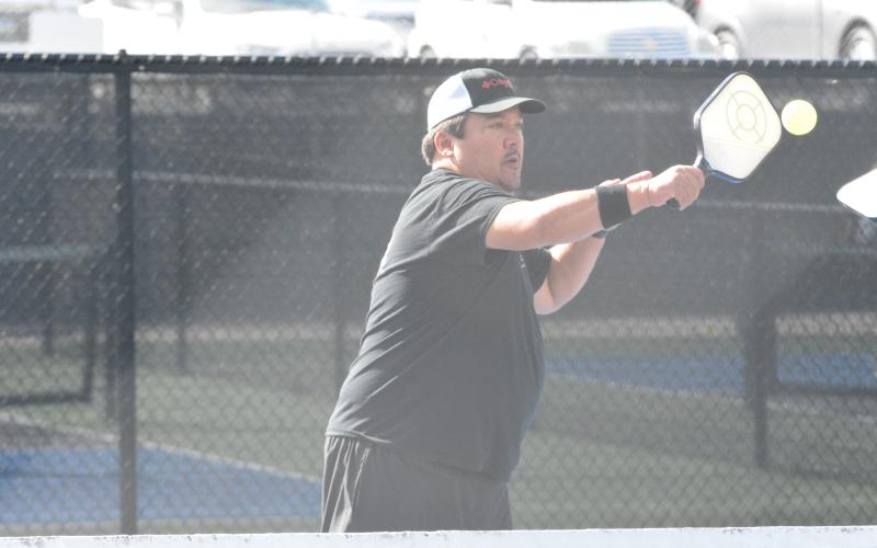 Kevin Geraty returns a serve in his doubles match at the Fall Freedom Pickleball Classic held in Hartwell on Friday, Nov, 4.