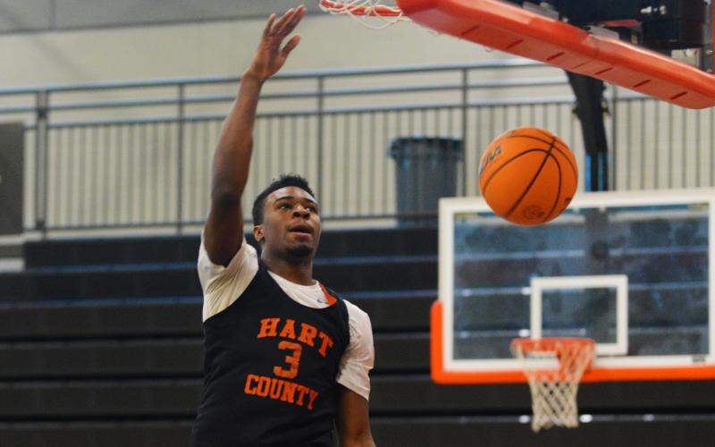 Senior Tahj Johnson finishes at the rim during practice on Nov. 1.