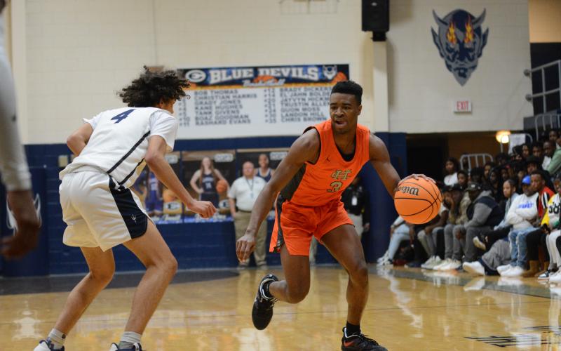 Senior forward Tahj Johnson drives to the basket in the Dogs’ big win over arch rival Elbert County in the Inferno, 69-45.
