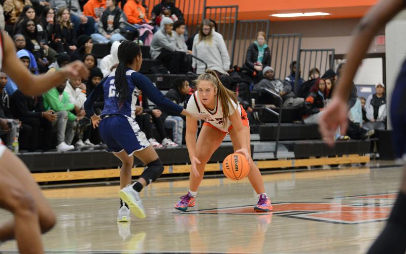 Junior guard Dakota Phillips guarded closely by a Lady Blue Devil in the home loss to rival Elbert County, 82-51.