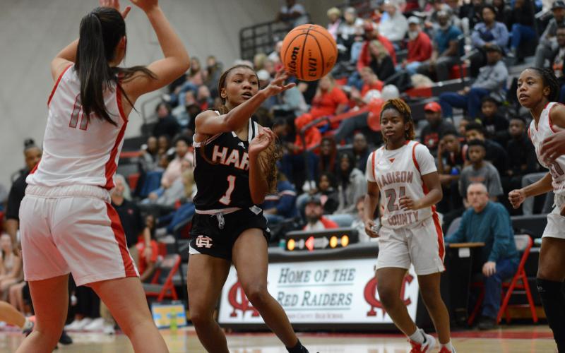 Senior guard Valasha Carter dishes it to an open teammate in the Lady Dogs close win at Madison County on Dec. 10.