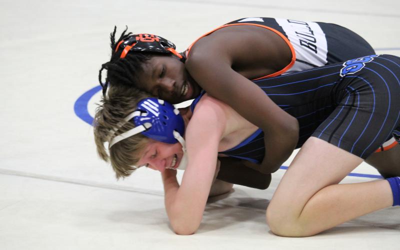 Hart County wrestler Carlveon Cheeks takes on an Oconee County opponent in a match.
