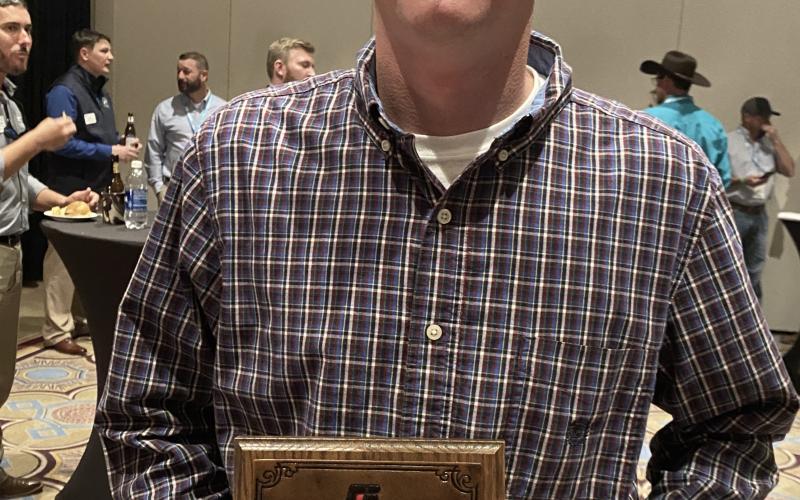 Brian Fleming, left, won the 2022 Georgia Farm Bureau Young Farmers &amp; Ranchers Excellence in Agriculture Award.