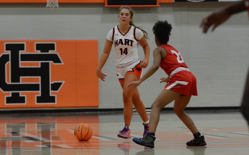 Junior guard Dakota Phillips dribbles past a defender in the 64-60 win over Wade Hampton High School to win the 15th annual McDonald’s Shootout hosted at Hart County.