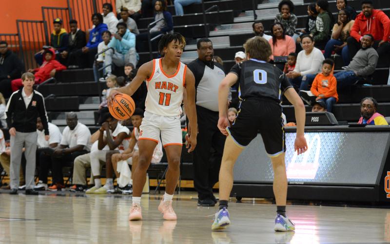 Jashon Gaines stares down an opponent before making a play at the rim.
