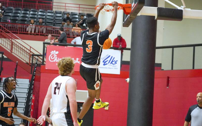 Senior forward Tahj Johnson slams it home in the 67-62 road win over Stephens County.