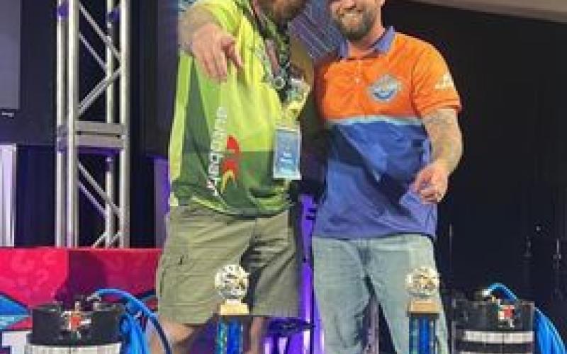 Kyle Whalen and Mike Powell celebrate a world championship in window tinting in Florida on Jan. 8.