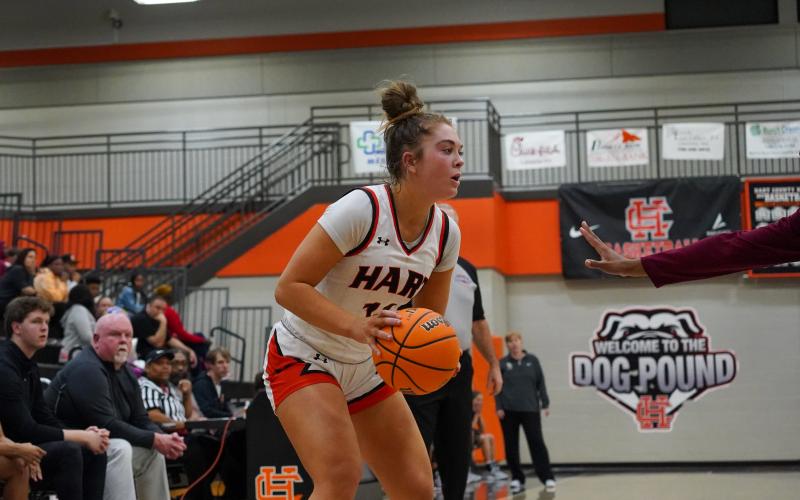 Junior guard Dakota Phillips prepares to shoot a three pointer in the 72-24 home loss to the Hebron Christian. Photo taken by Lexie Wheless.