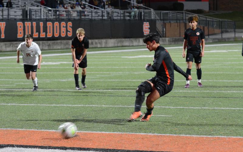 Pictured is junior midfielder Axsel Fajardo scoring off a penalty kick in the double overtime win versus Stephens County, 3-2.