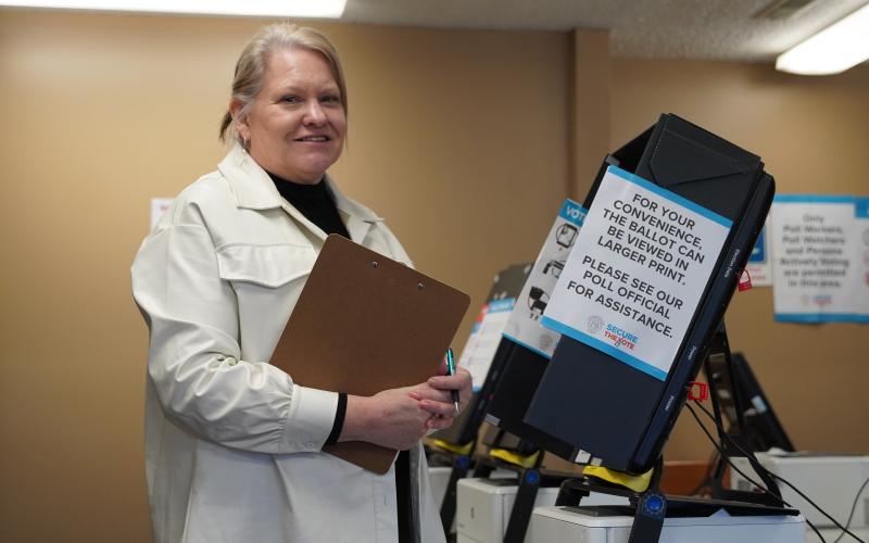 Hart County Elections Coordinator Robin Webb inspects one of the voting machines on Monday, as she finished the final preparations before Election Day on Tuesday.