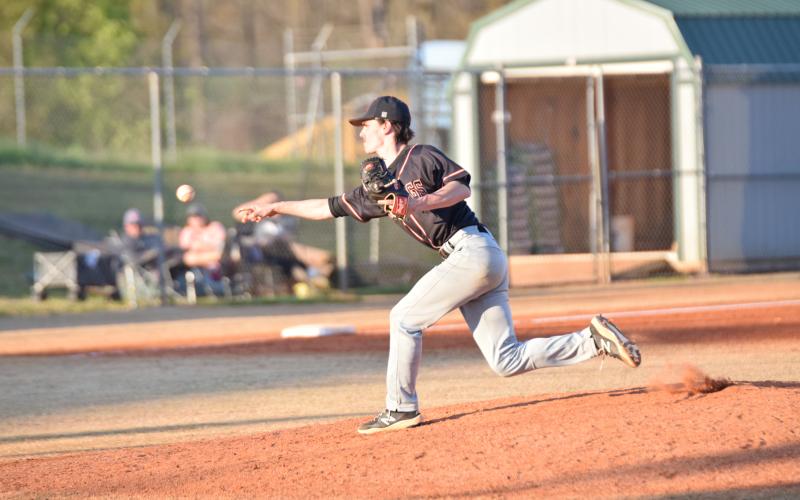 Senior relief pitcher Jordan Leach delivers a fastball in the 16-8 loss in game one of the double header at Franklin on March 23. The Diamond Dogs also lost game two of the double header by a score of 13-10 and were swept by the Lions.