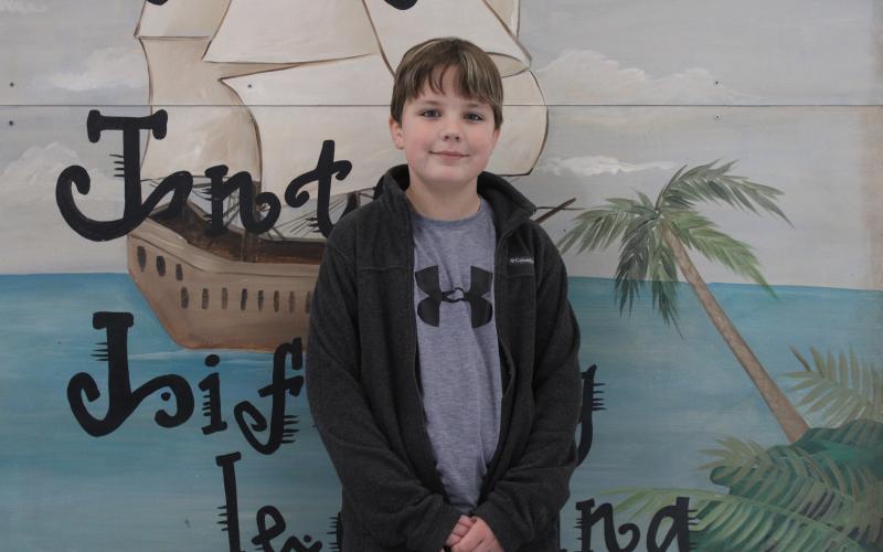 The system-wide Young Georgia Authors contest winner from North Hart Elementary for fourth grade, Slate Martin. Not pictured is Lily Seawright, first-grade winner.
