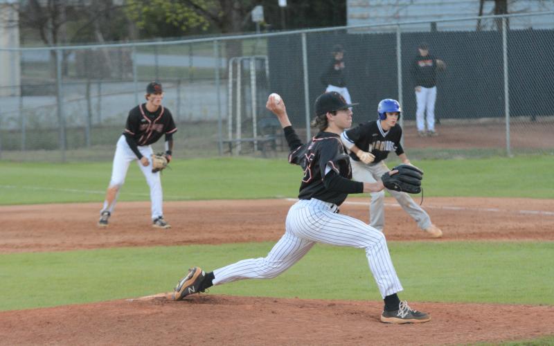 Junior starting pitcher Will Pittman delivers a pitch as the Dogs fall to Oconee in the double header on March 16.