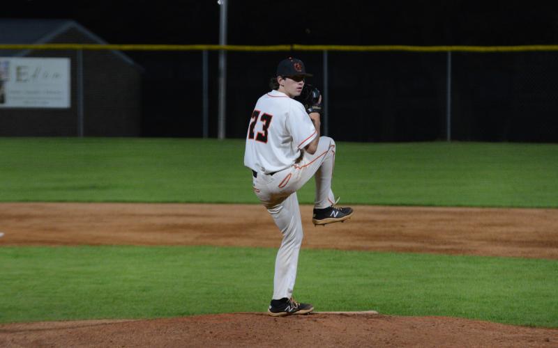 Junior pitcher Will Pittman winds up to deliver a pitch in the 7-1 loss against Prince Avenue Christian at home on Tuesday.