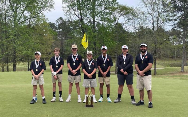 Pictured is the middle school boys team with their region runner-up trophy. Pictured left to right is Gavin Carter, Kaleb Hendrix, Andrew Brown, MJ Miller, Powell Chiang, Bo Osborne, and coach Mason Buchanan.