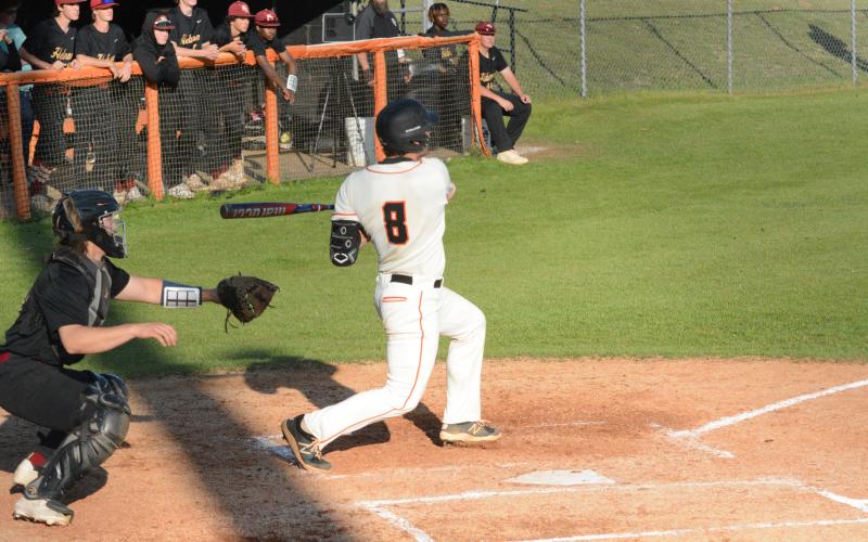Pictured is senior catcher Riley Posey as he led the Dogs in hits with three in the game one home win over Hebron Christian, 7-3 on Thursday, March 30.