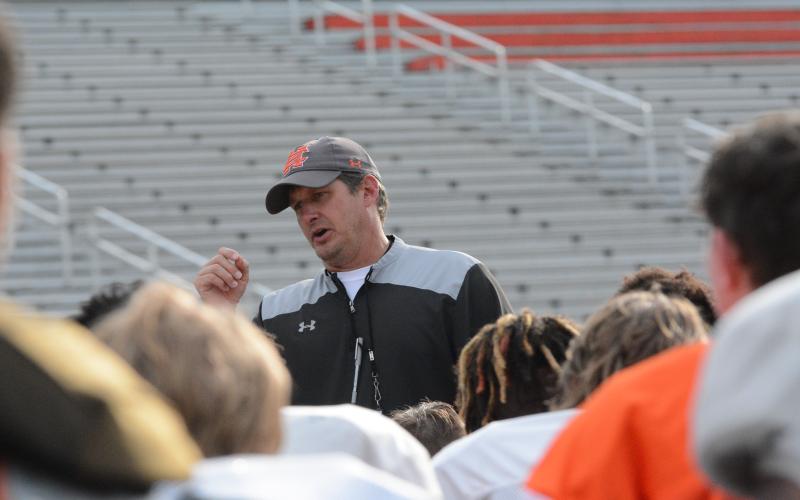 Head coach Cory Dickerson talking with the team after the team’s first day in full pads on Monday, May 8.