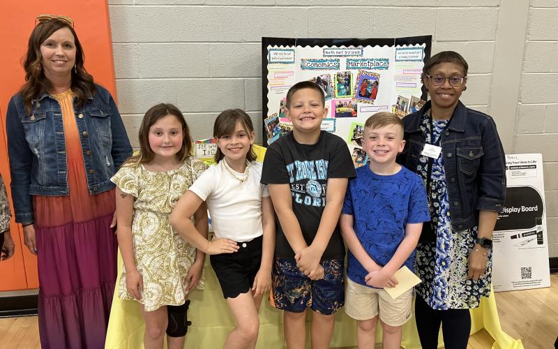 Third graders at North Hart Elementary showcased their economic marketplace at this year’s STEAM Showcase. Pictured are (L-R) Jamie Roberts, Lailan Carter, London Reagin, Brayden Shankle, Harrison Carter and Debbie Hughes.