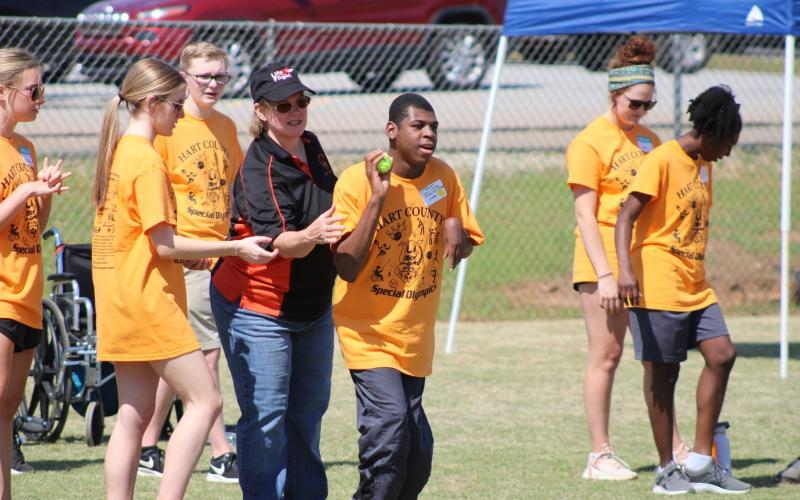 Pictured are athletes and volunteers at the 2023 Hart County Special Olympics on April 21. Pictured at the top is Addison Krause, Lyra Osborne, Hudson Milner, Noelle Reese, J’Shawn Jones, Ella Lake Carter, and Azaria Hickman helping in the shot put event.