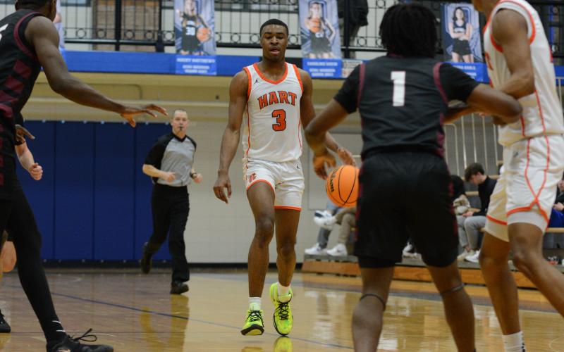 Forward Tahj Johnson (3) drives to the lane in the 47-43 win over Hebron Christian in the Region 8-AAA consolation game at Oconee County on February 17.