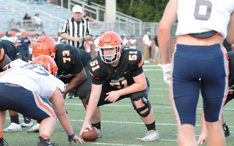Rising junior offensive lineman Adam Broom (51) gets ready to snap the football during the 2023 spring game versus Habersham Central on Friday, May 19 from Herndon Stadium.
