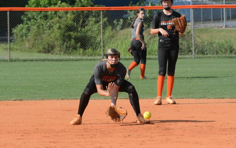 Sophomore infielder Madi Bennett grounds a hard hit ball to second base during a summer practice as the Lady Dogs prepare for their season opener on August 5 at Gainesville.