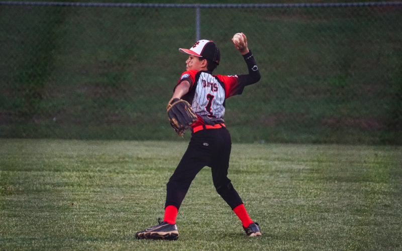 Pictured is Coby Davis fielding the ball that was hit to the outfield on Monday, June 26.
