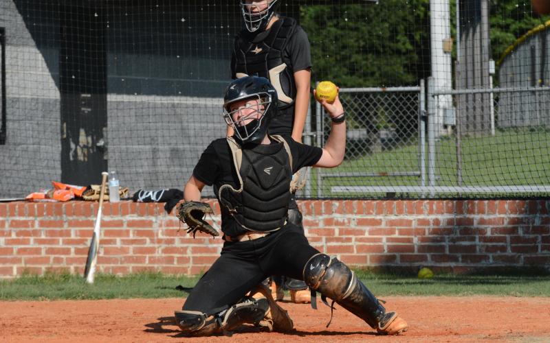 Junior catcher Skylar Dutton practicing throwing out the runner at second.