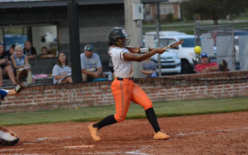 Senior infielder Jazz Shealer makes contact with the ball and picks up a hit against the Lady Tigers of Washington-Wilkes Aug. 24 in the 11-1 loss.