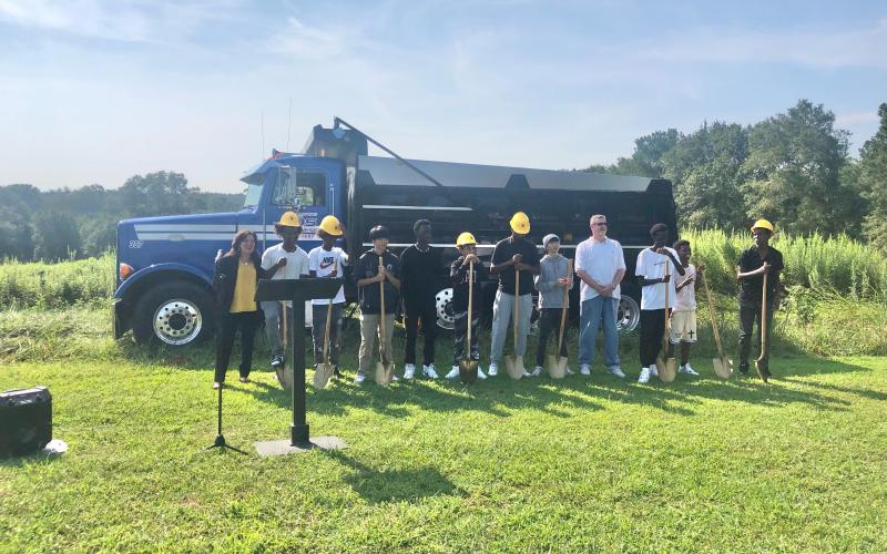 Pictured from left is Sarah LeCroy, Administrator, Nahom Haile (Ethopia), Amanuel Haile (Ethiopia), Yu Deng (Japan), Chris Hajabakiga (Rawanda), Oune Hijazeen (Jordan), Yosilas Feyisa (Ethopia), Jimin Chun (South Korea), Coach Steve Lux, Eli Hajabakiga (Rwanda), and Nolawi Gulti (Ethiopia).