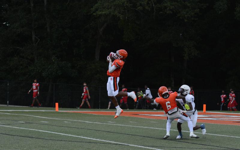 Senior quarterback and cornerback Jashon Gaines makes an interception against Powdersville.