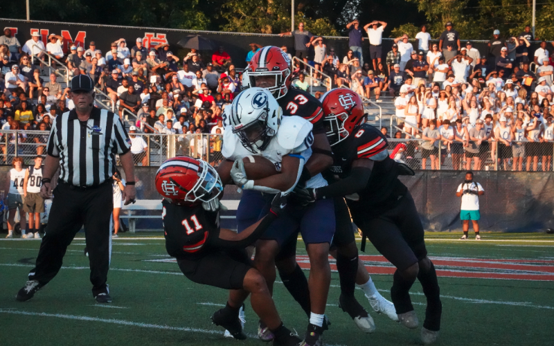 A host of Bulldog defenders tackle the Blue Devils running back in the 24-14 loss to Elbert County in the season opener. (Photo by Lexie Wheless)