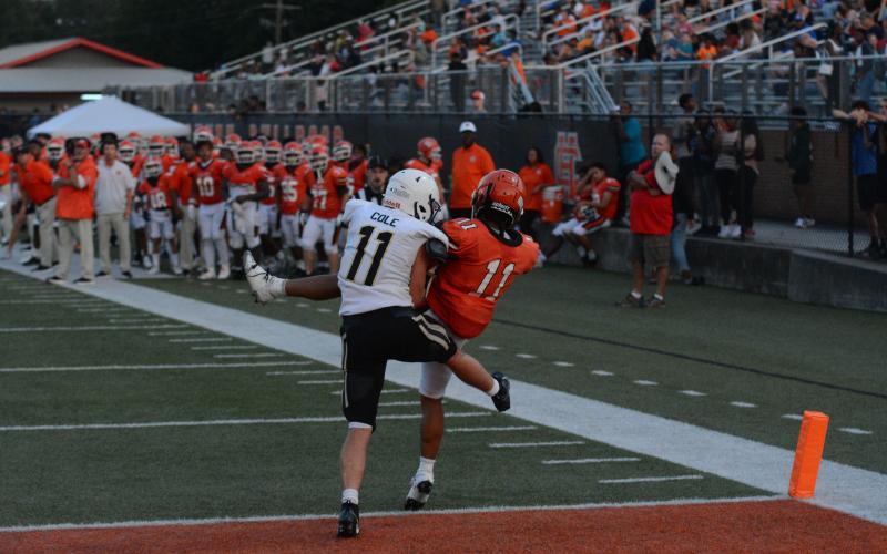 Junior wide receiver Trey Martin comes down with the catch for a touchdown against T.L. Hanna as the Dogs dropped both games in the Gridiron Classic in Herndon Stadium Friday, Aug. 11.