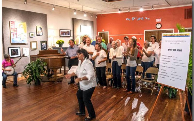 Maureen DeLoach engages the audience to sing during a performance of the Hart Area Community Chorus.