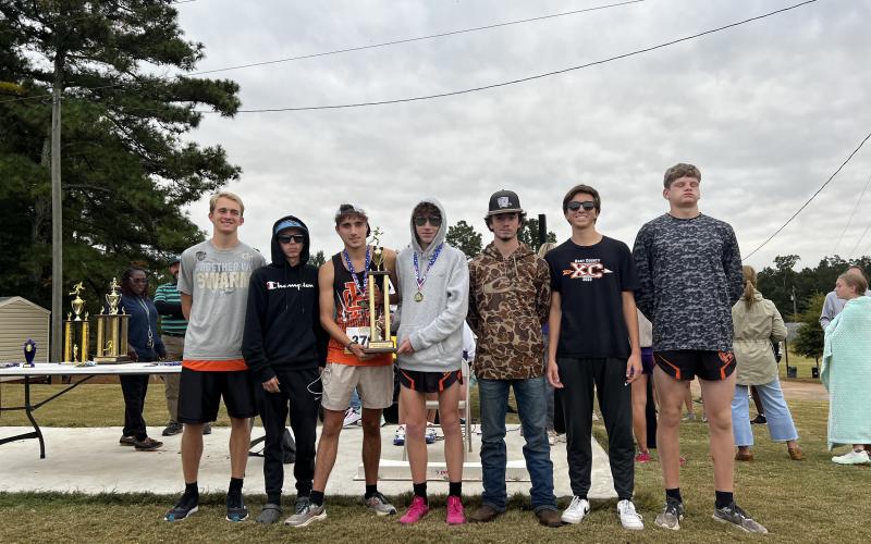 Pictured is the Hart County High School boys cross country team hoisting the first place trophy as they placed first in the purple division at Athens Christian Oct. 14. From left to right is Will Bell, Damian Childress, Nate Harris, Braydon Lane, Donavin Layman, Zach Simmons, and Ethan Stovall.