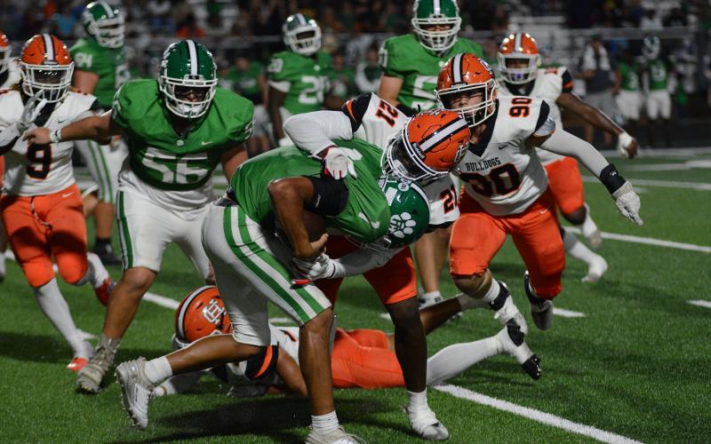 Junior linebacker Isaac Durrett (21) tackling Franklin County’s quarterback for a loss.