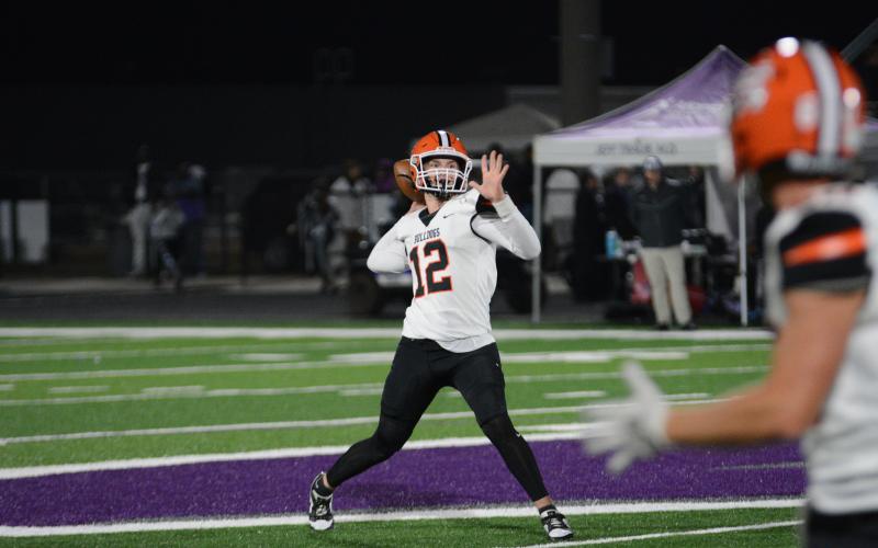 Senior quarterback Kip Phillips slings a 42-yard pass to senior wide receiver Jashon Gaines to tie it at 7-7 in the first quarter of play, as the Dogs would go onto fall to Monroe Area on the road, 23-14.