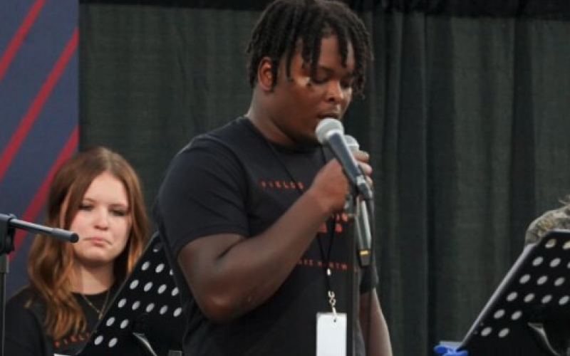 Pictured left is senior football player Trez Fouch as he shares his testimony.