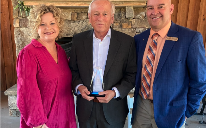 Photo to the left: Mr. Charles Corbett, center, who was named this year’s ‘Pioneer in Education’, poses for a photo alongside Superintendent Jennifer Carter, left, and Associate Superintendent Brooks Mewborn, right.