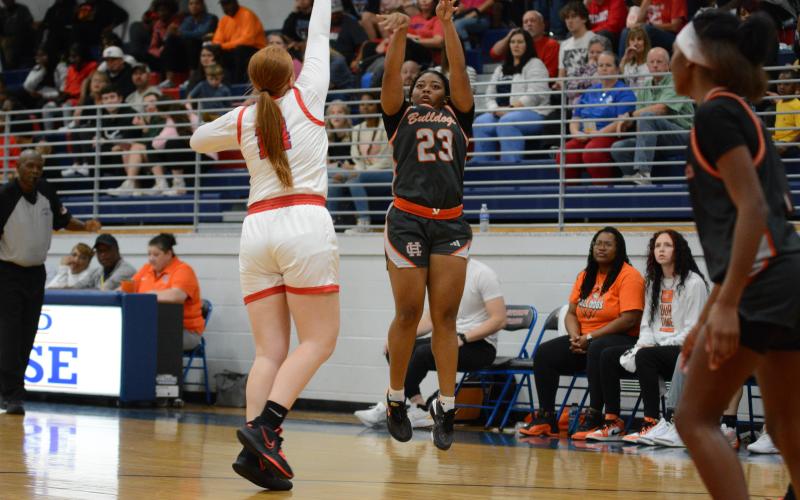 Junior guard TK Smith (23) knocks down three-three pointers in the 62-40 win over Oglethorpe County in a scrimmage game on Nov. 9 in Lexington. The Lady Dogs now prepare to take on Commerce at Franklin County on Nov. 16.