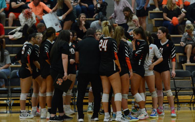 Pictured is the Volley Dogs huddled up after dropping the first set as Oconee County went onto defeat Hart County in four sets to end the Volley Dogs historic season on Oct. 28.