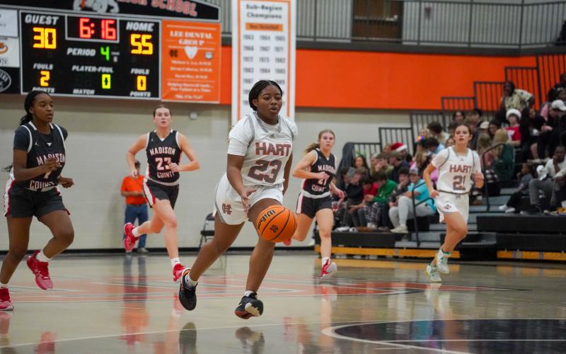Junior guard TK Smith (23) and senior guard Dakota Phillips (not pictured) scored 20 points each, and combined for 40 points  in the 68-41 win over Madison County on Dec. 8. (Photo by Lexie Wheless)