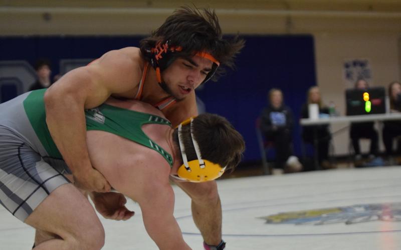 Senior Peyton White wrestles against a Mat Lion at the 2024 Area Duals on Jan. 6.