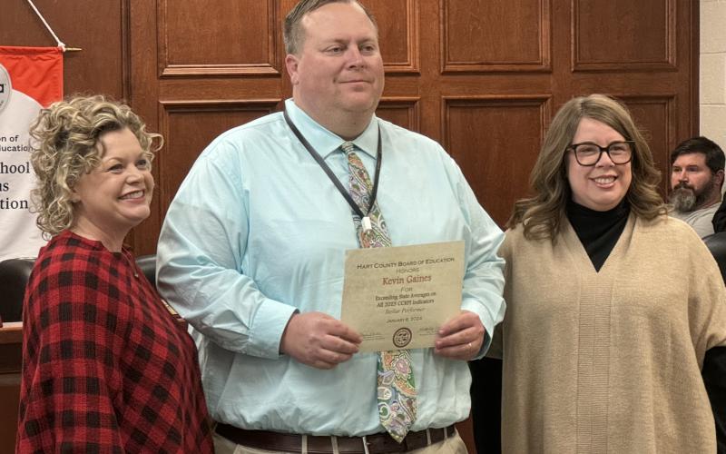 From left to right: Superintendent Jennifer Carter, HCHS Principal Kevin Gaines, and Board Chair Kim Pierce. Gaines was recognized for HCHS exceeding the state average in all five categories of the College and Career Readiness Performance Index (CCRPI).