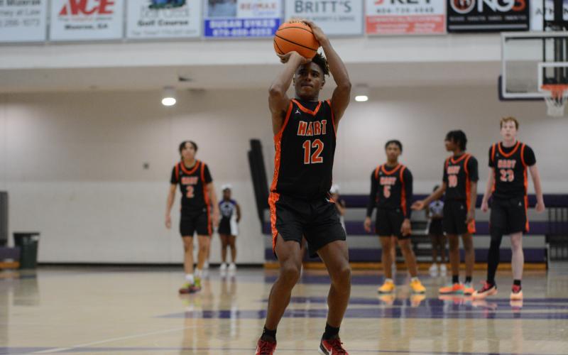 Freshman guard Kurston Curry makes his free throws to seal the win against Monroe Area.