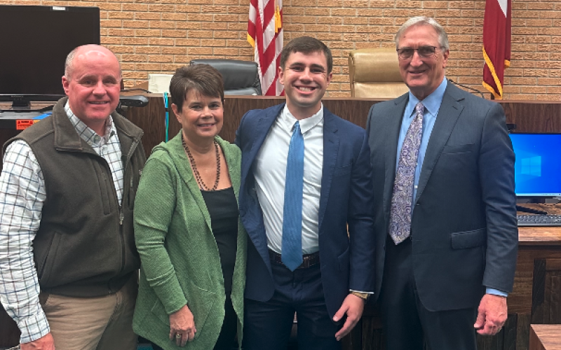 Pictured from left to right: Keith Brown (dad), Jackie Brown (mom), Nicholas Brown, and Judge Jeffery Malcom.