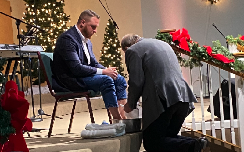 Pictured at the top is Dr. Brad Starnes as he humbly watches former senior pastor of Cornerstone Baptist Church Terry Meeks wash his feet.