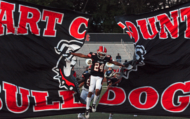 Riyan Partlow (24) runs through the banner before kickoff against Bulloch Academy on Sept. 22, 2023.