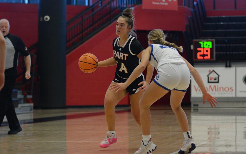 Senior guard Dakota Phillips dribbles the ball up the court against Oconee on Feb. 14.
