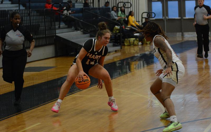 Senior guard Dakota Phillips crosses up a defender in the 64-44 win over Frederick Douglass High School in Atlanta on Feb. 20 to advance to the sweet sixteen.